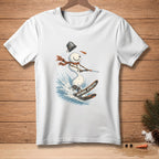 White t-shirt with snowman skiing through water, wearing a scarf and bucket hat.