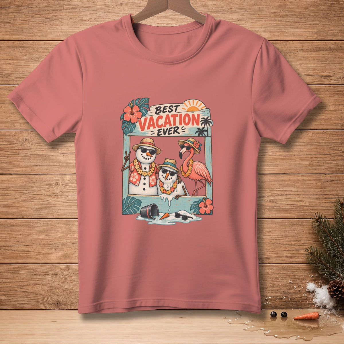 T-shirt graphic with snowmen and flamingo in vacation scene, says "BEST VACATION EVER".