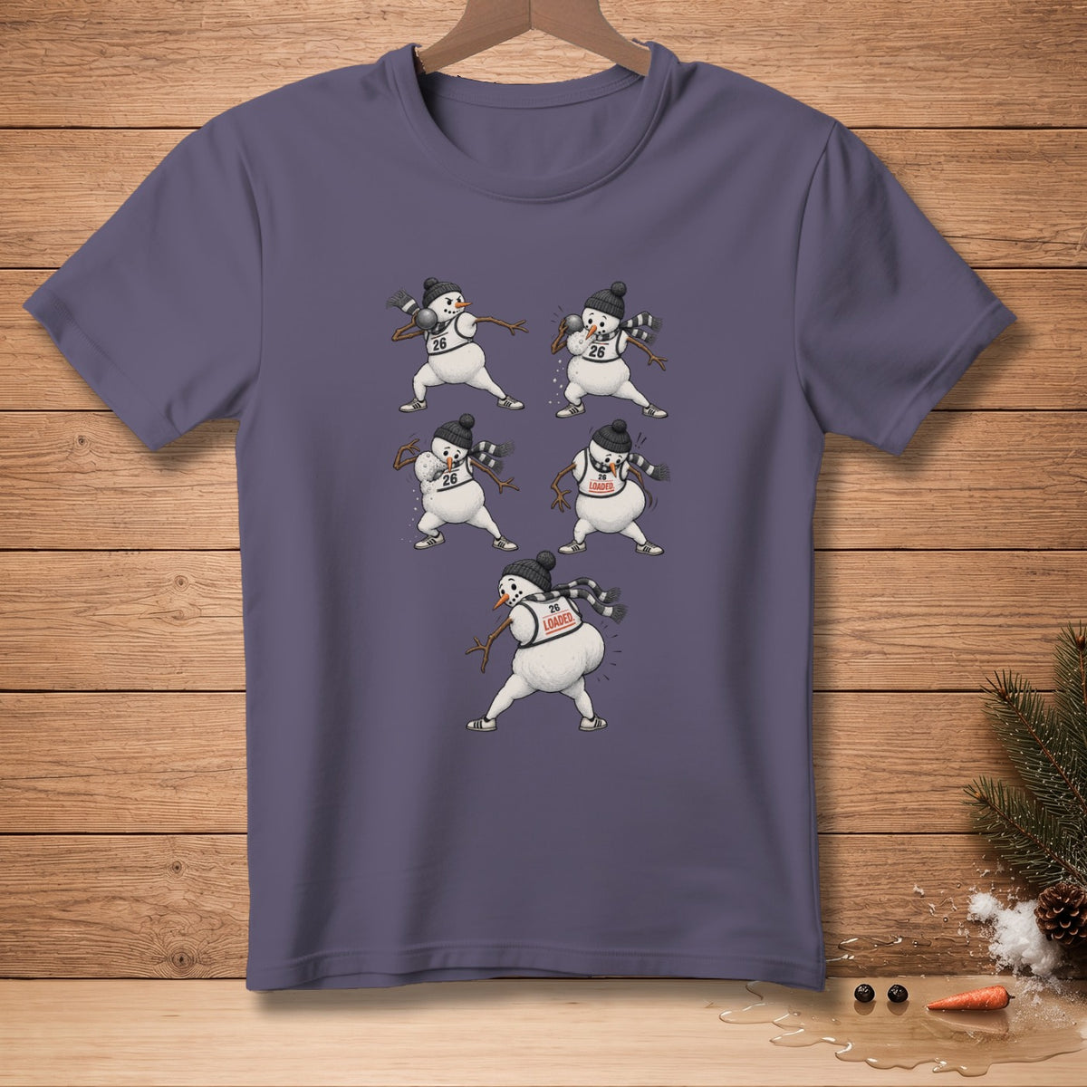 T-shirt with snowmen doing various exercises, some wearing "26" and "LOADED".