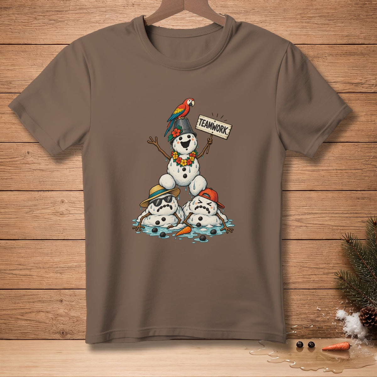 Melting snowmen, one with a parrot, hold a "TEAMWORK" sign.