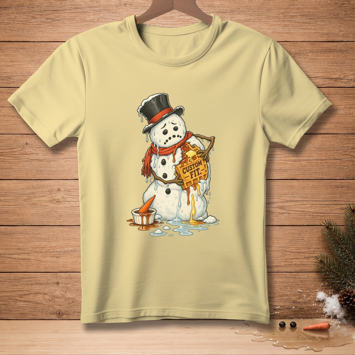 Melting snowman with a waffle that says "Custom Fit" on a pale yellow t-shirt.