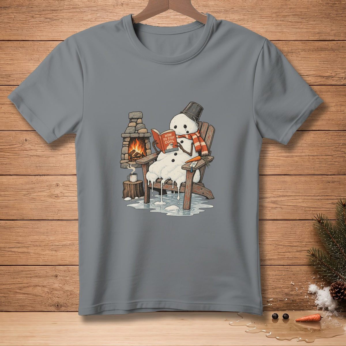 Melting snowman in chair reads "How To Stay Cool" book by fireplace.