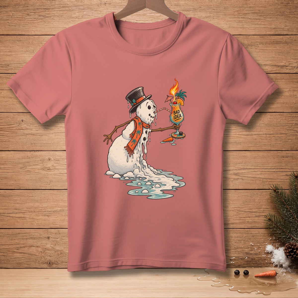 Melting snowman in a hat and scarf holds a cocktail with "Bad Idea" text.