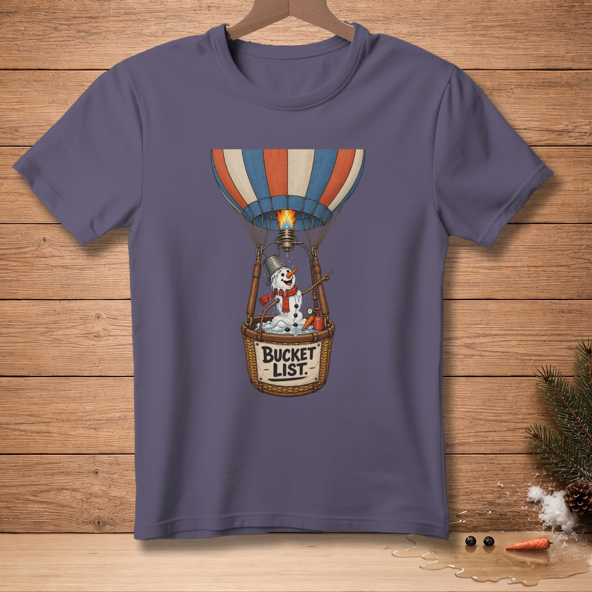 Snowman in hot air balloon basket with "BUCKET LIST" text.