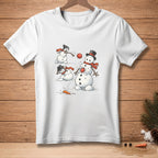 White t-shirt with cartoon snowmen playing in the snow and tossing a snowball.