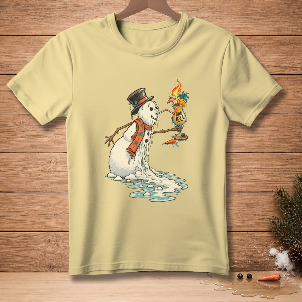 Yellow t-shirt with melting snowman wearing a hat and scarf holding a cocktail.