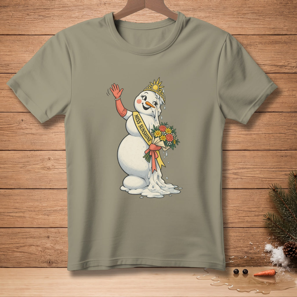 Melting snowman with "Miss Sunshine" sash, crown, and bouquet on a tan t-shirt.