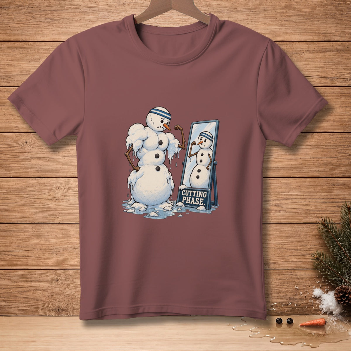 Muscular snowman flexing in mirror, "CUTTING PHASE" sign.