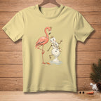 Light yellow t-shirt with a flamingo and melting snowman wearing a "Miss Poise" sash.