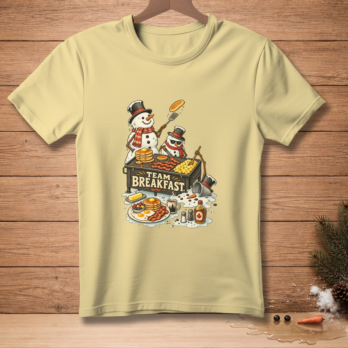 Snowmen making breakfast on a grill with "TEAM BREAKFAST" text.