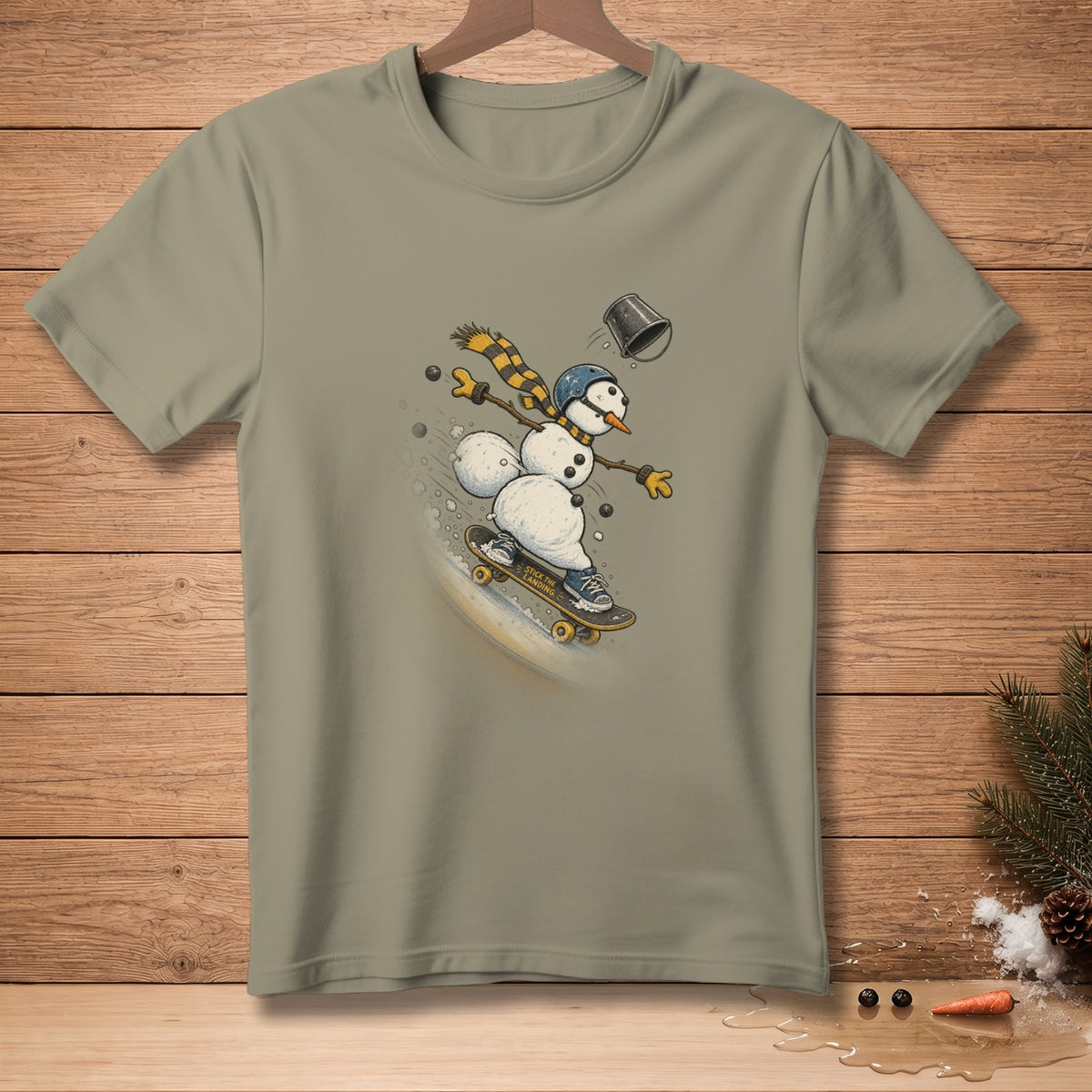 Snowman wearing scarf and helmet skateboarding, text "Stick the landing" on skateboard.