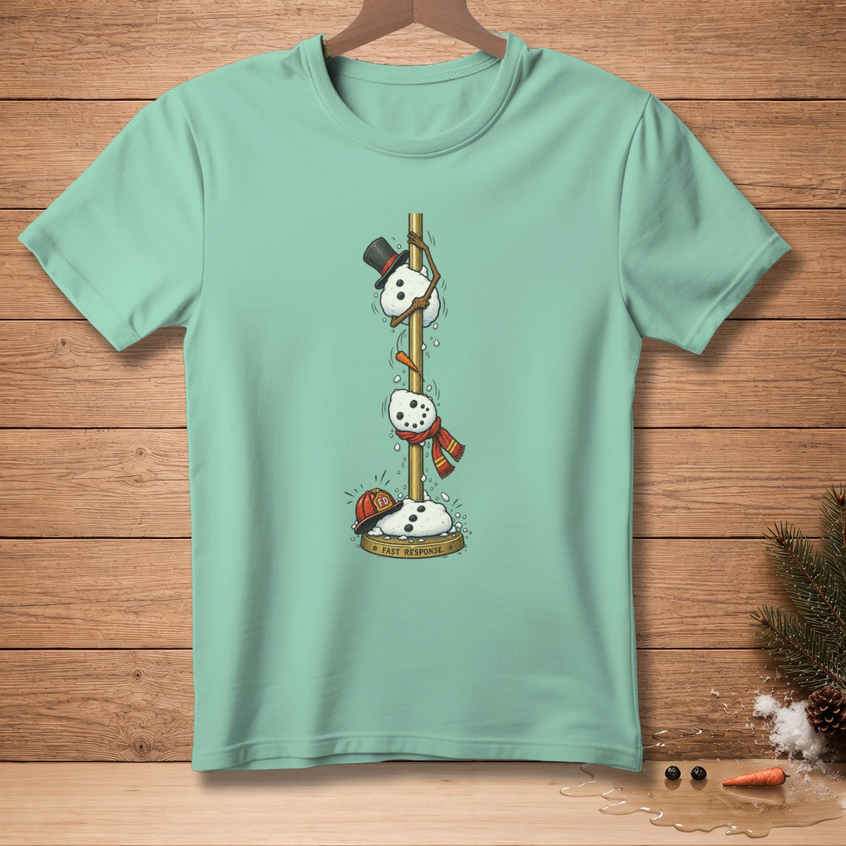 T-shirt with snowmen climbing a pole, one wearing a top hat, one a scarf, and one a fireman's hat with "FAST RESPONSE" text.