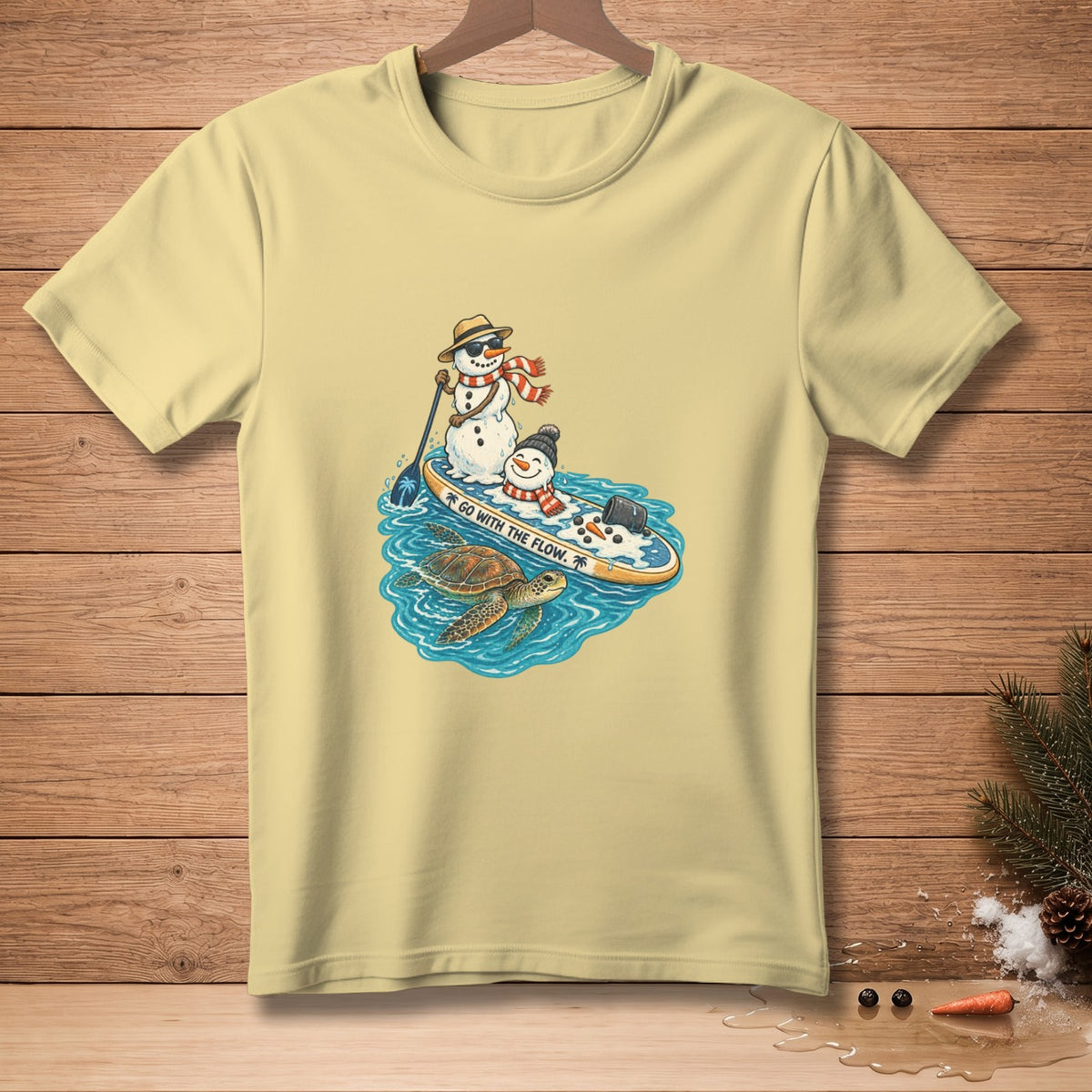 Snowmen on paddleboard with turtle, text "GO WITH THE FLOW".
