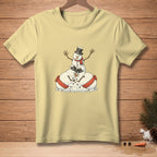 Light yellow t-shirt with cartoon snowmen piled on top of each other wearing hats and scarves.