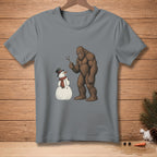 Bigfoot holding a stick, facing a snowman with a top hat and scarf.