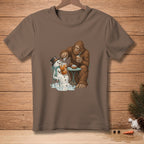 Bigfoot pours ice into a melting snowman's drink at a small table.