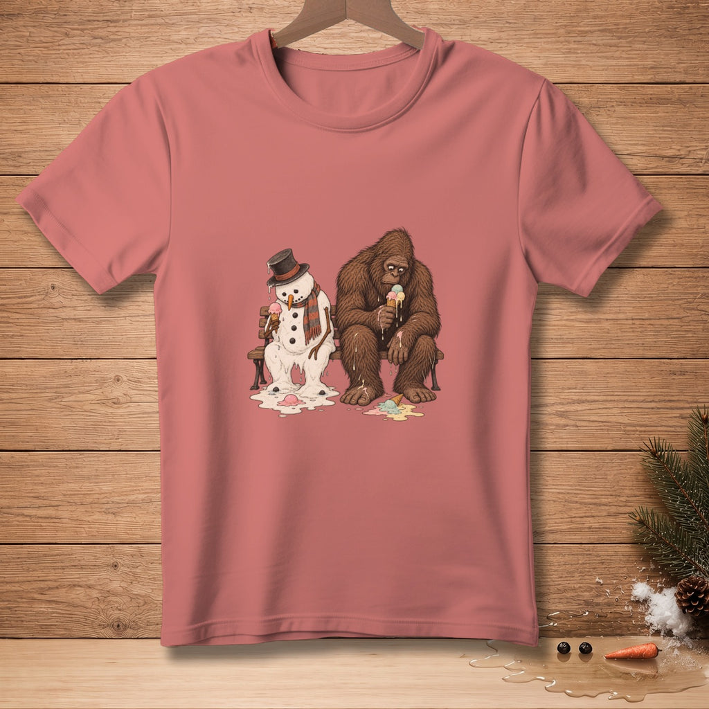 A melting snowman and Bigfoot sit on a bench eating ice cream cones.