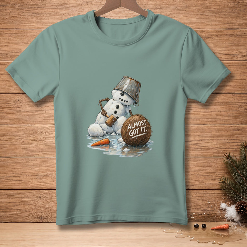 Snowman with bucket on head, holding mallet, near melting coconut saying "Almost Got It".