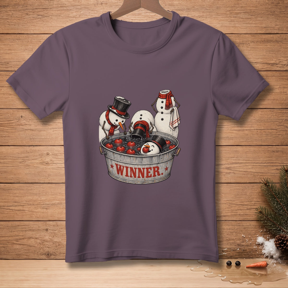Snowmen bobbing for apples in a tub labeled "WINNER."