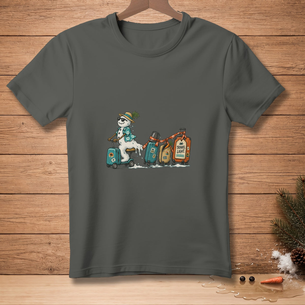 Snowman on a scooter pulling luggage with "Travel Light" text.