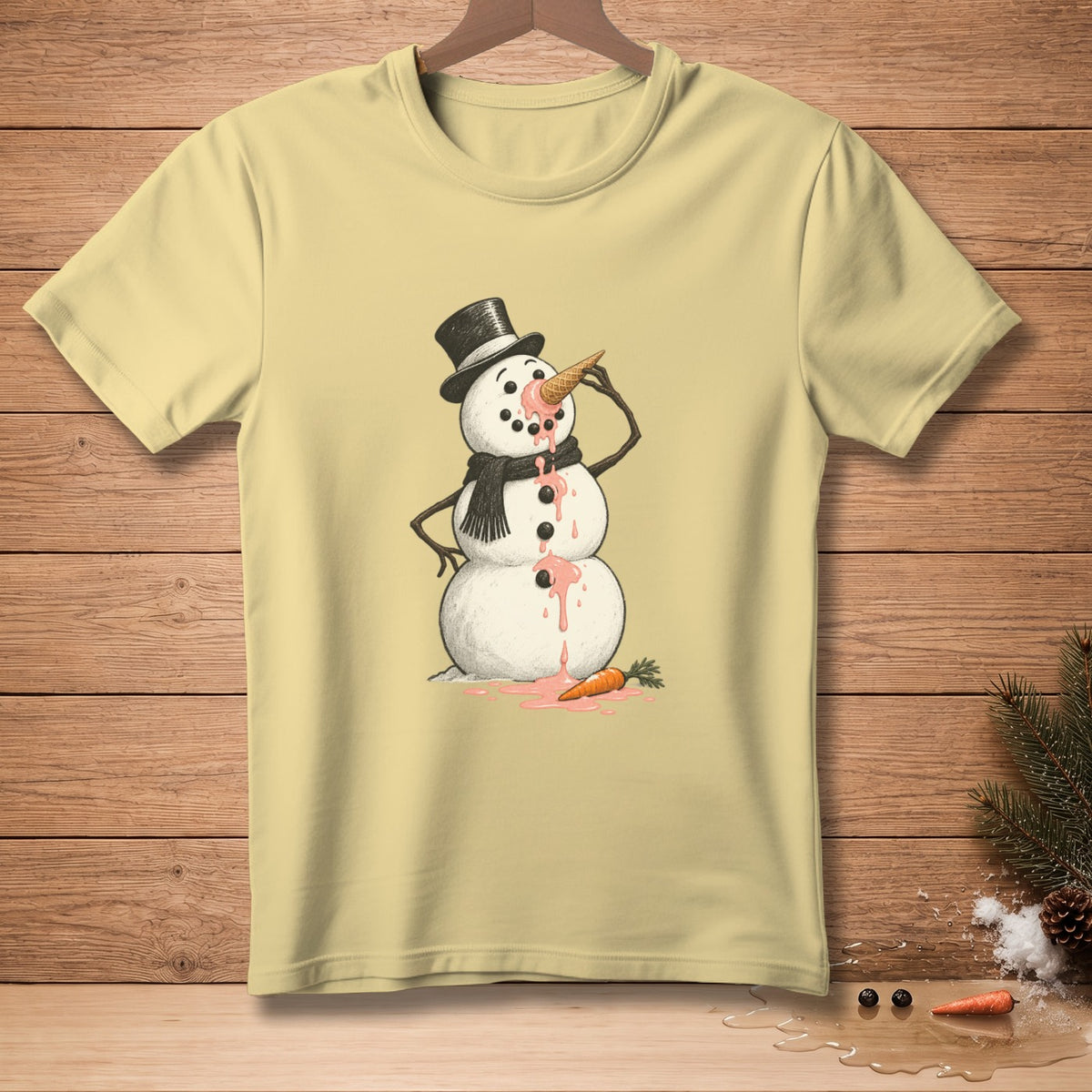 Yellow t-shirt with melting snowman wearing a hat and scarf eating ice cream.
