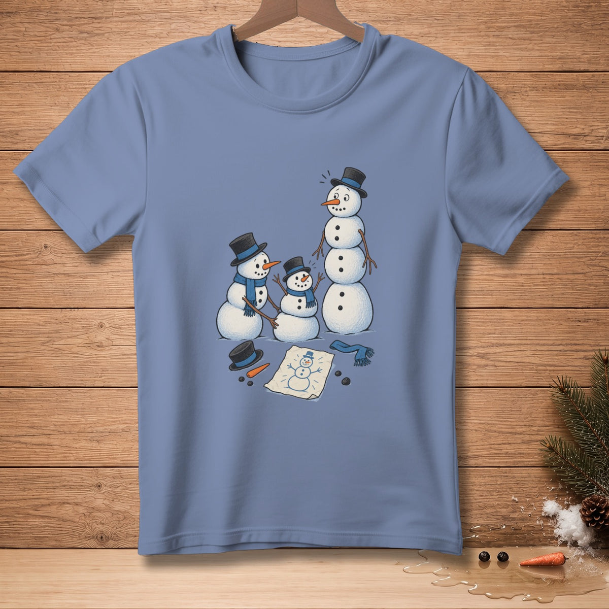 Three snowmen, one large and two smaller, stand near a snowman drawing and scattered accessories.