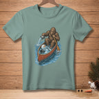 Bigfoot paddles a canoe with a melting snowman and bucket of water.