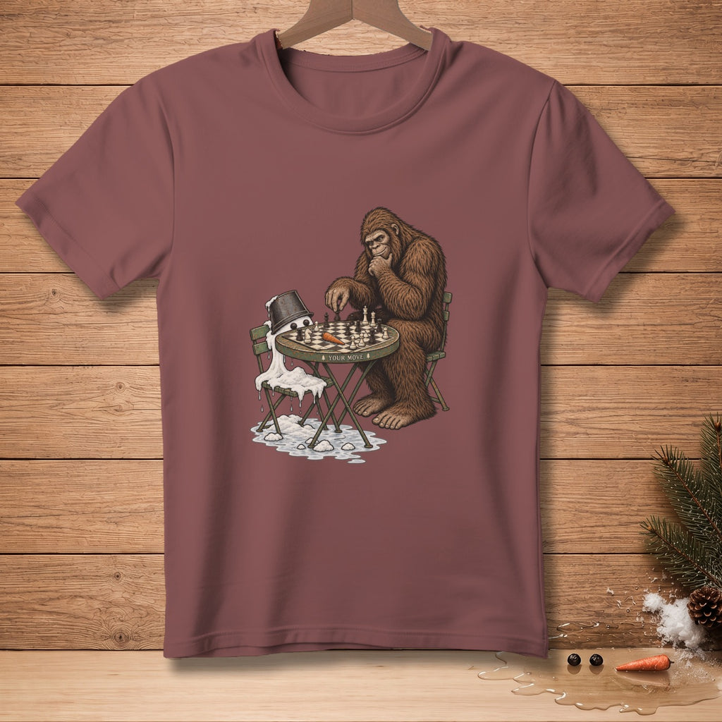 Bigfoot plays chess with a melted snowman next to a bucket with "Your Move" text.