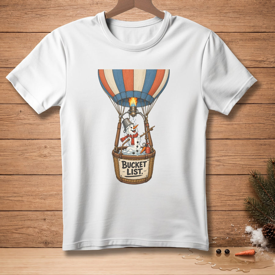 White t-shirt featuring a snowman in a hot air balloon with "BUCKET LIST" text.