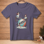 T-shirt graphic of snowmen playing volleyball with a ball that says "BLOCKED".