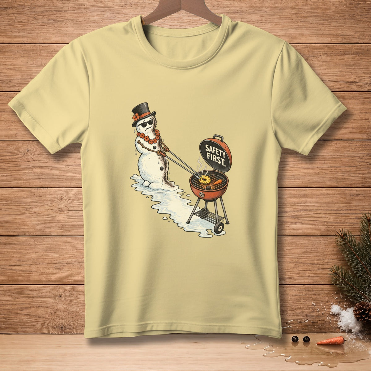 Snowman wearing sunglasses and a hat grills pineapple rings with text "Safety First."