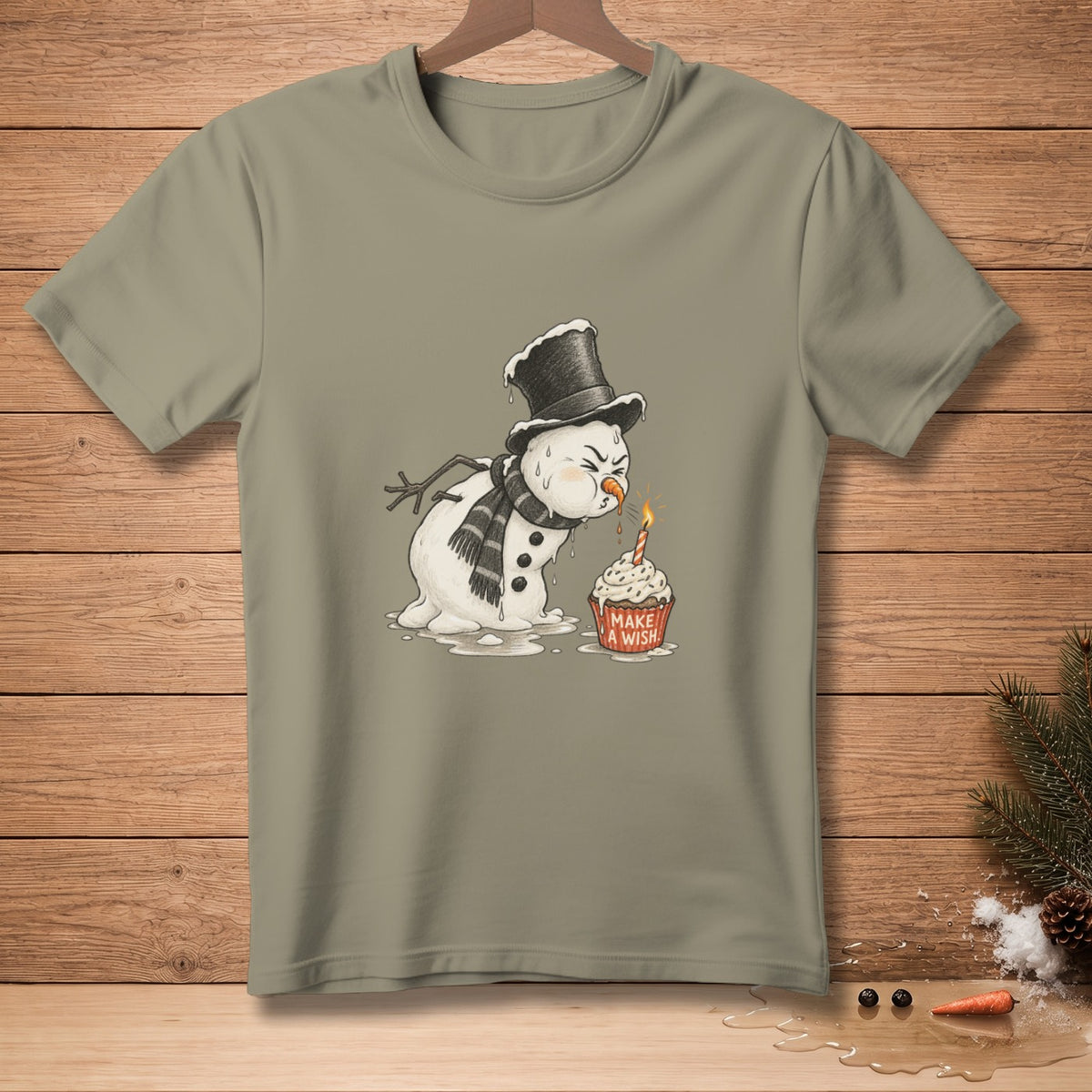 Melting snowman in a hat and scarf blows out birthday candle on cupcake.