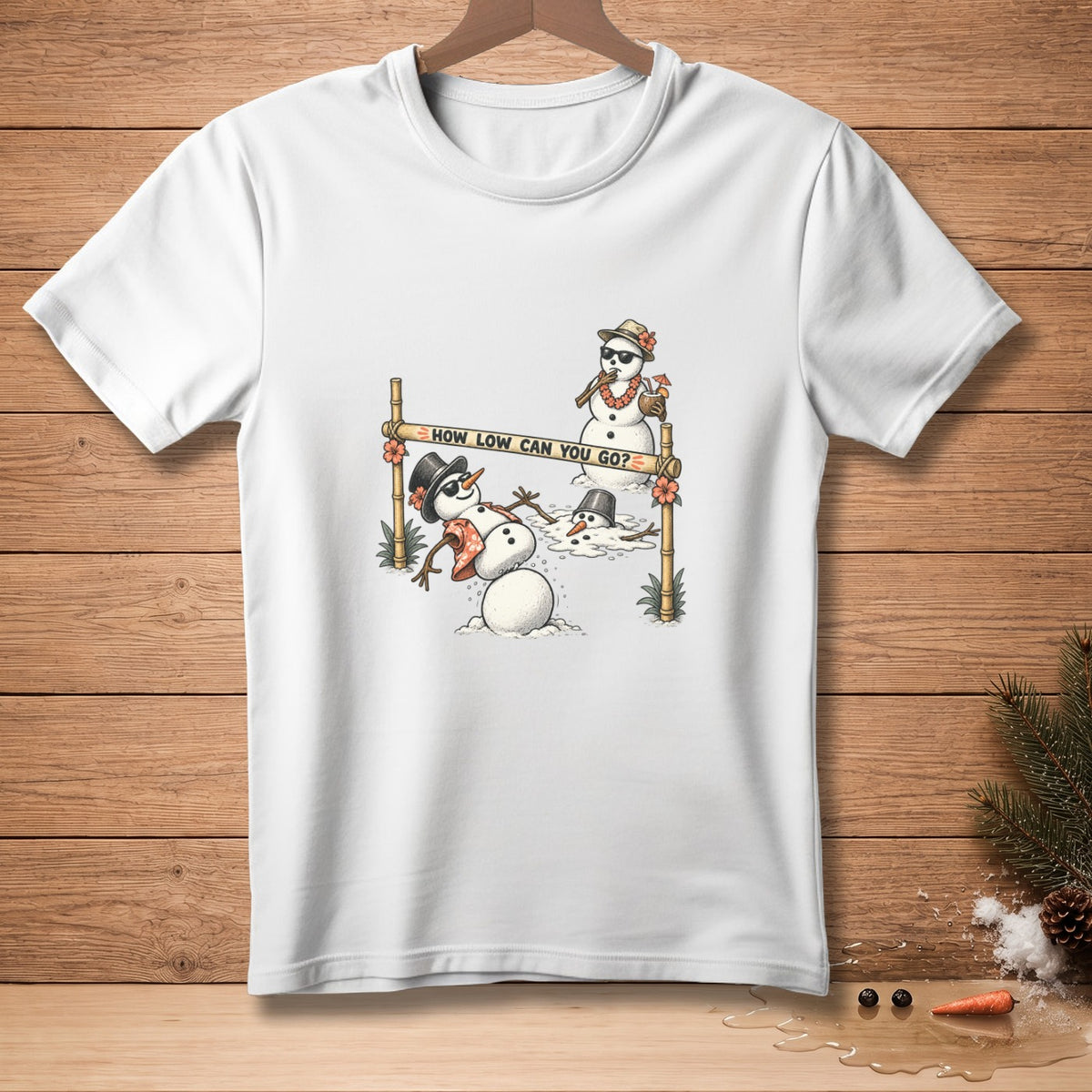 White t-shirt with cartoon snowmen playing limbo, text reads "HOW LOW CAN YOU GO?".