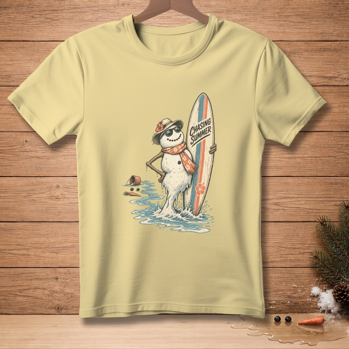 T-shirt with a melting snowman holding a surfboard and wearing sunglasses.