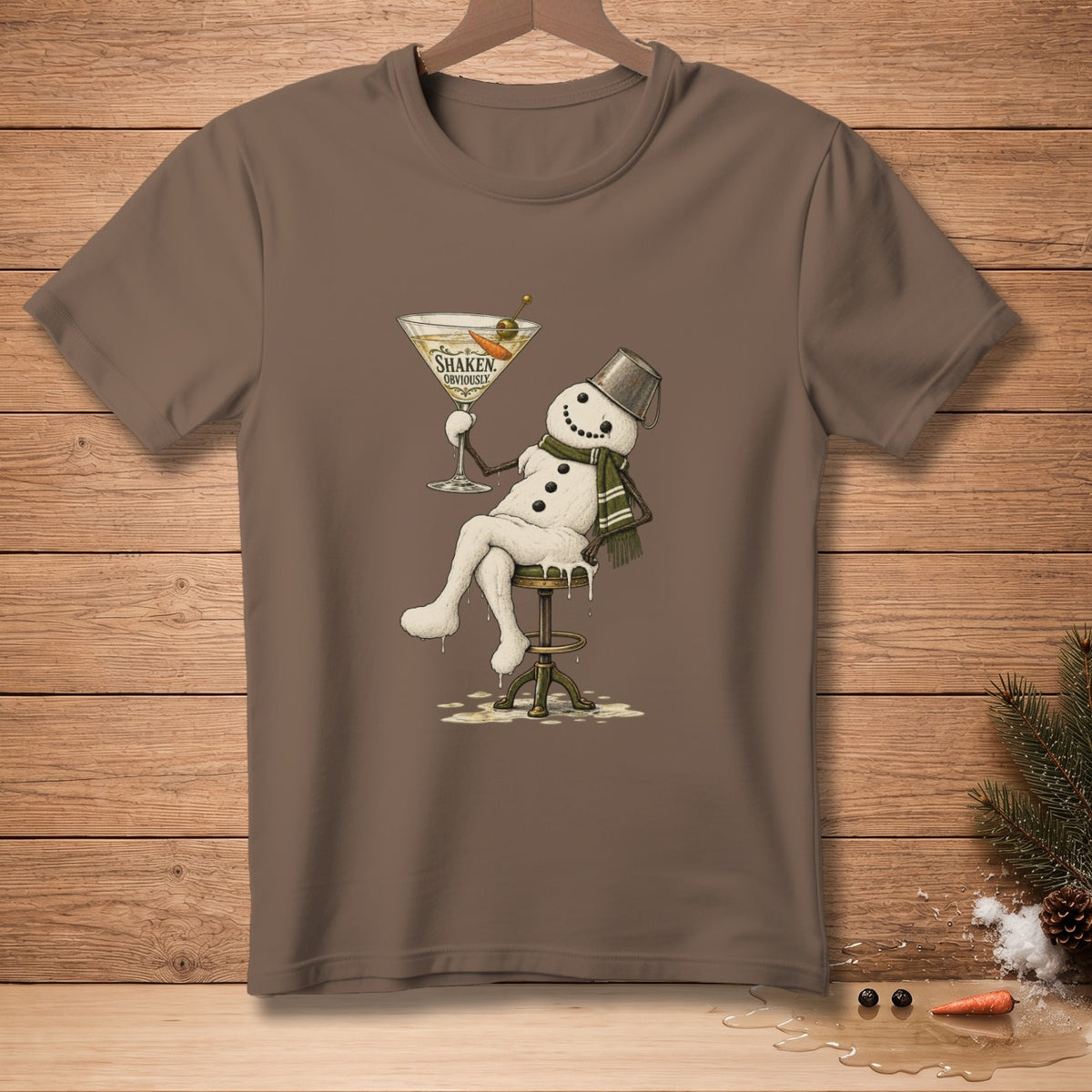 Snowman with martini glass on t-shirt reading "Shaken, Obviously."