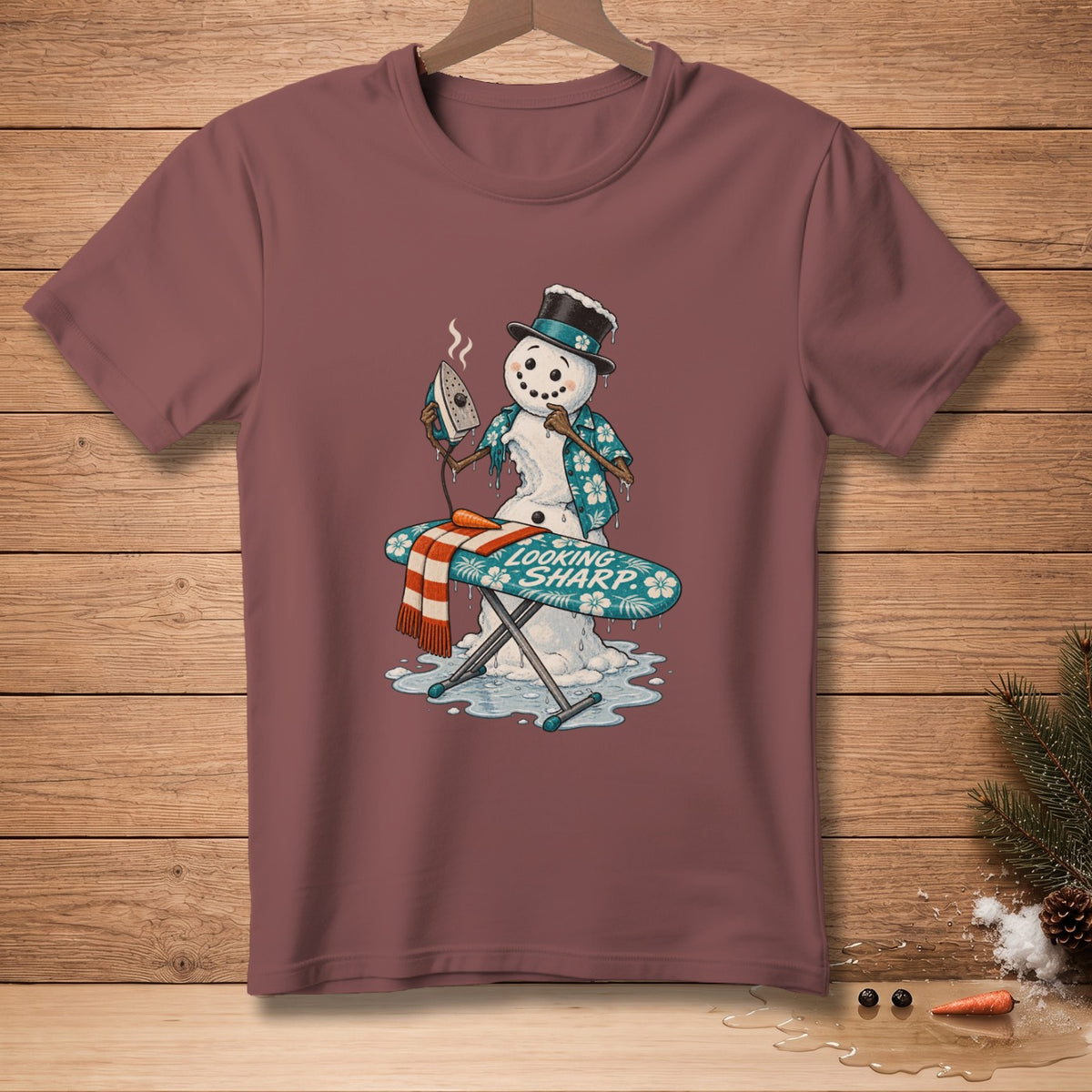 Snowman ironing a scarf on an ironing board with "Looking Sharp" text.