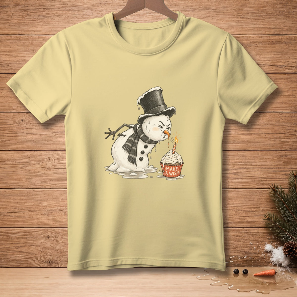 Melting snowman in a top hat about to blow out a cupcake candle that says "Make a Wish".