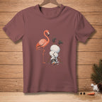 Flamingo standing next to a snowman doing a handstand with boots on.