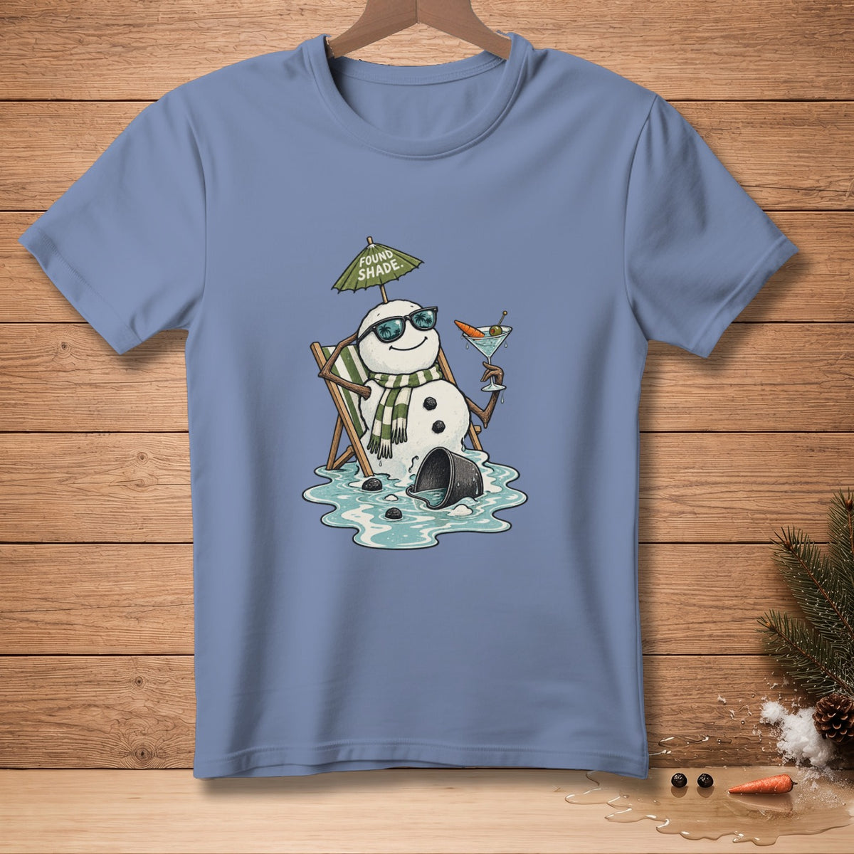 Snowman in lounge chair with sunglasses, umbrella, and drink under "Found Shade."
