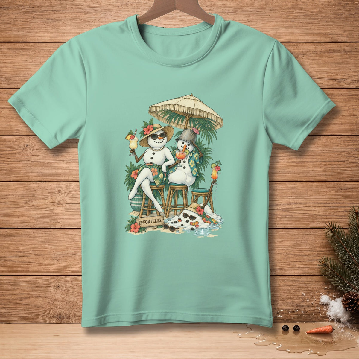 Two snowmen with tropical drinks sit under an umbrella, melting on a beach.