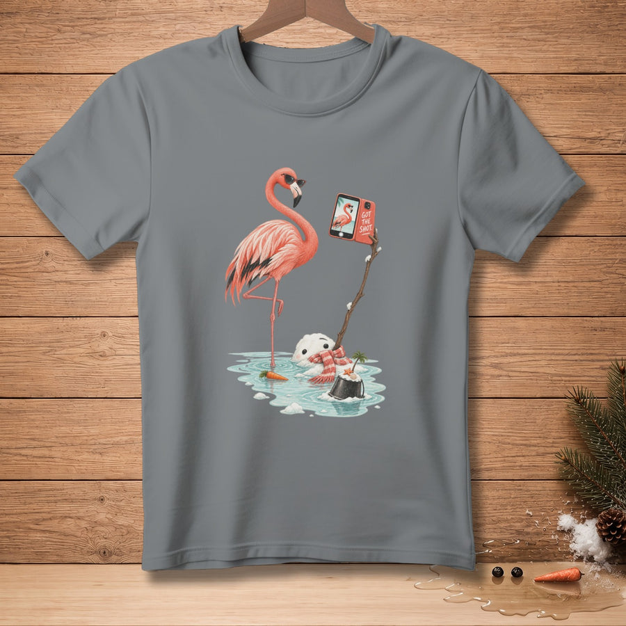 Flamingo taking selfie with snowman in melting snow, phone reads "Got the shot."