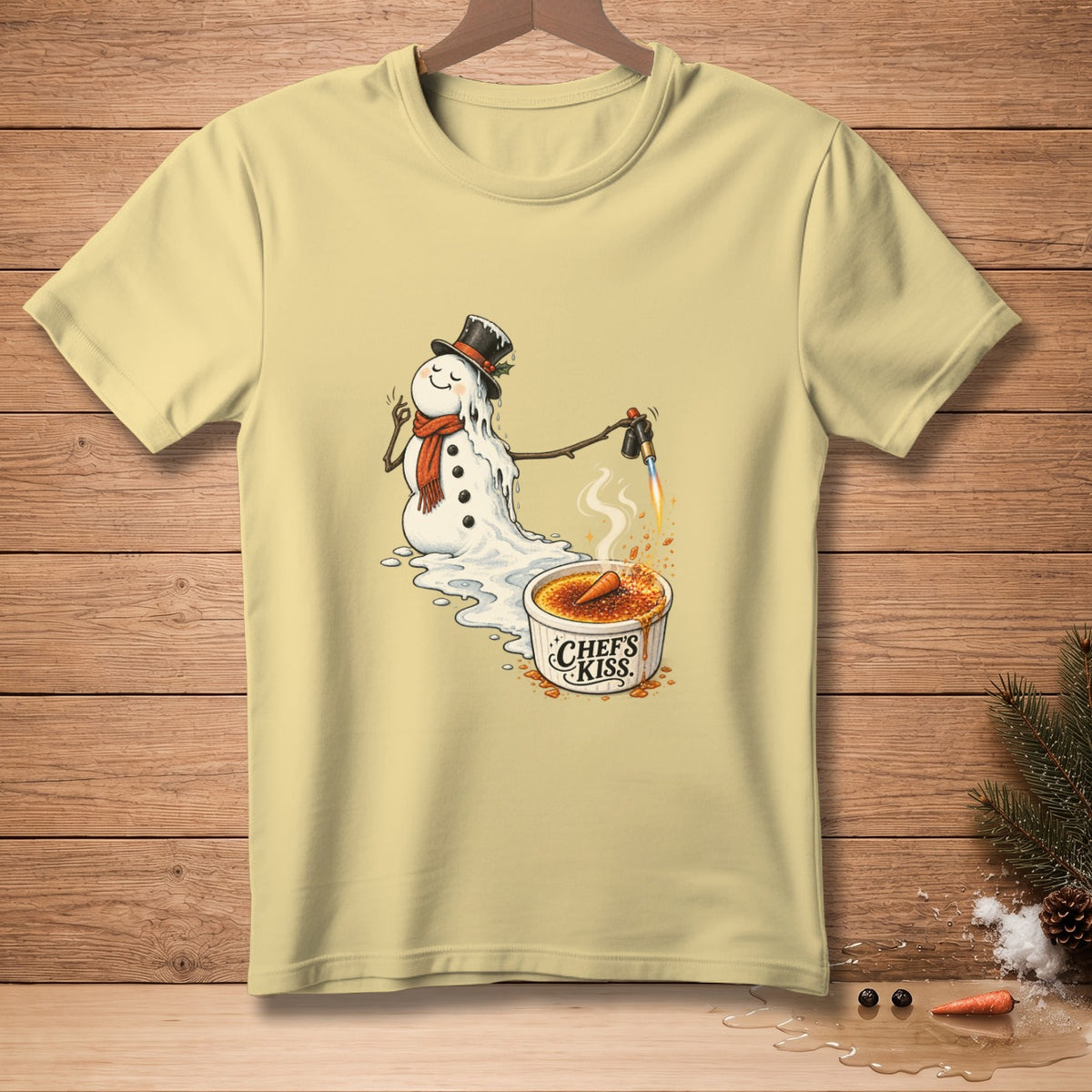 Melting snowman using a torch on creme brulee with "Chef's Kiss" text.