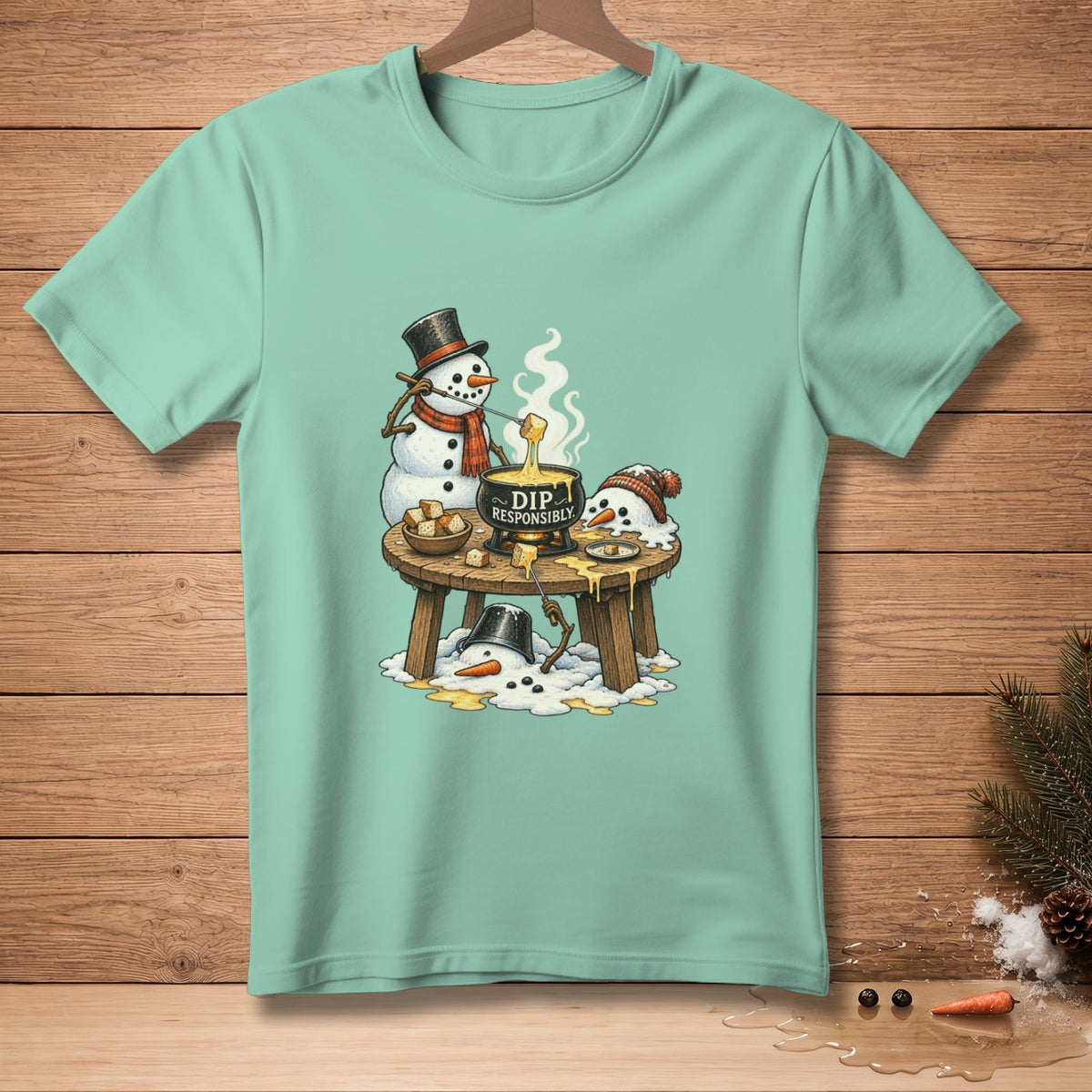 Snowmen enjoying fondue with "DIP RESPONSIBLY" text on pot.