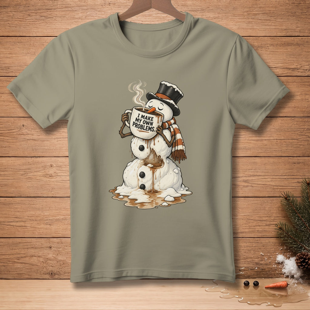 Snowman in a hat and scarf drinks from a mug that says "I make my own problems."