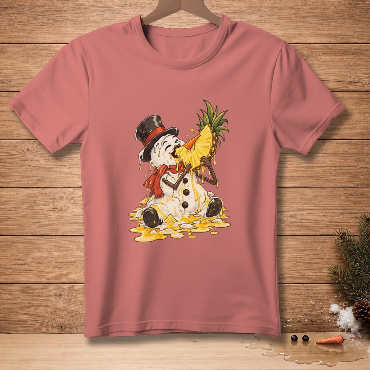 Melting snowman in top hat eating a pineapple slice on a pink t-shirt.