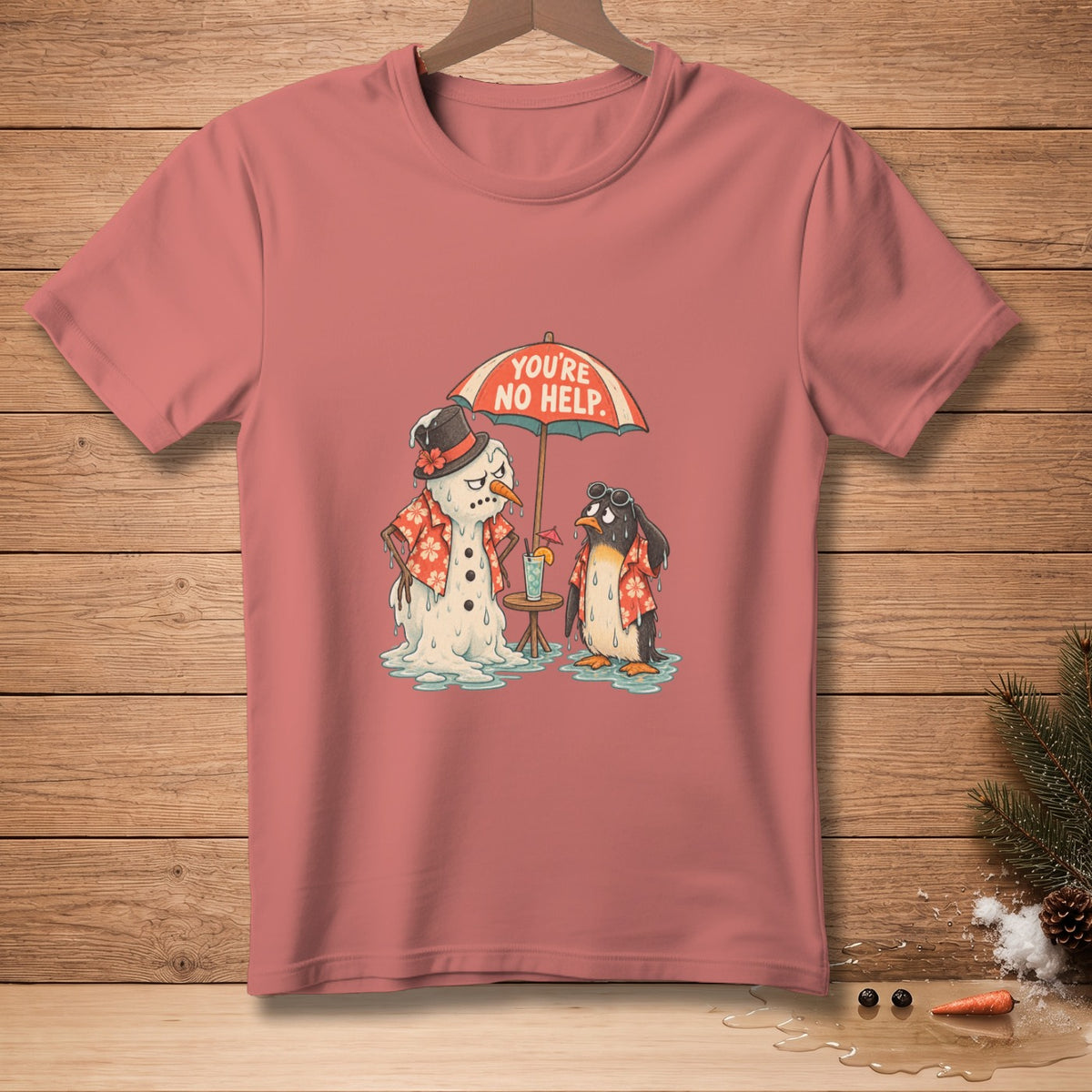 T-shirt graphic of melting snowman and penguin under umbrella with text "YOU'RE NO HELP".