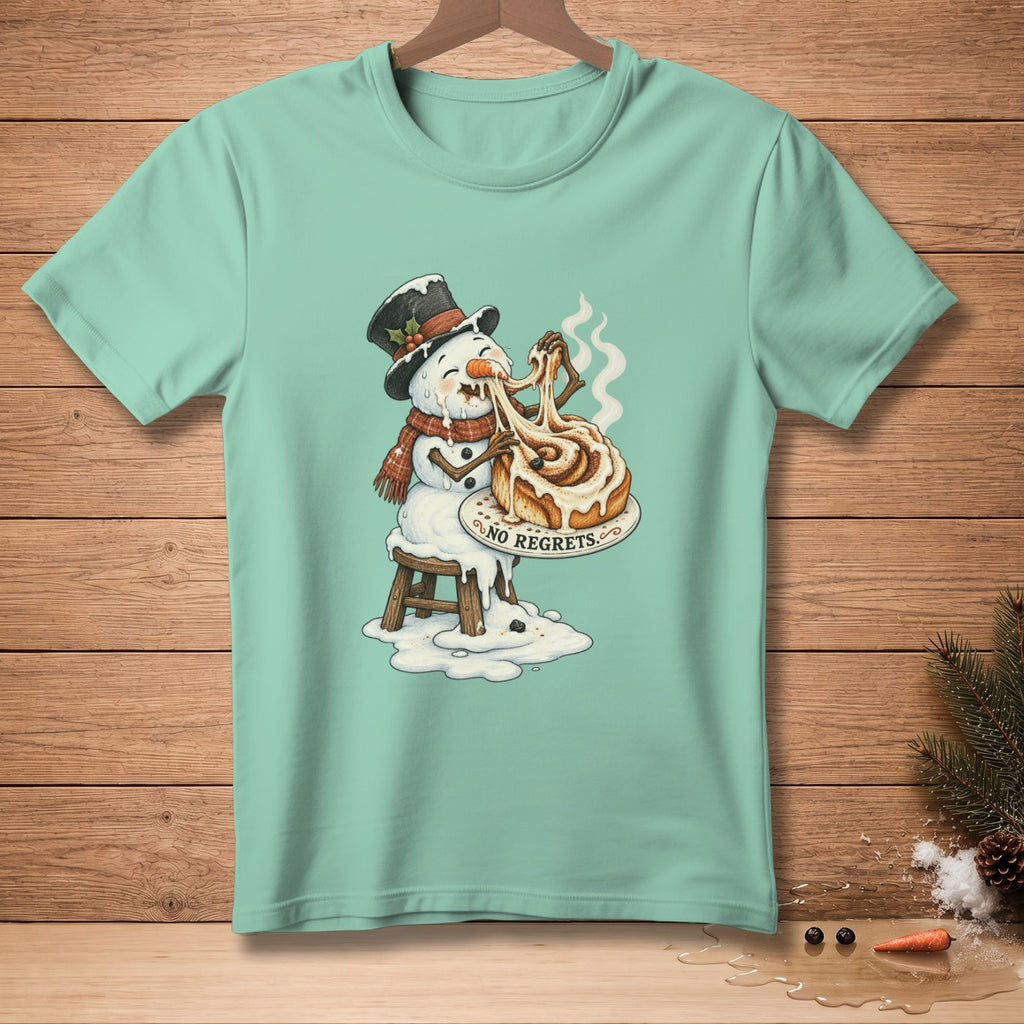 Snowman wearing hat and scarf, melting while eating a cinnamon roll, text "NO REGRETS".