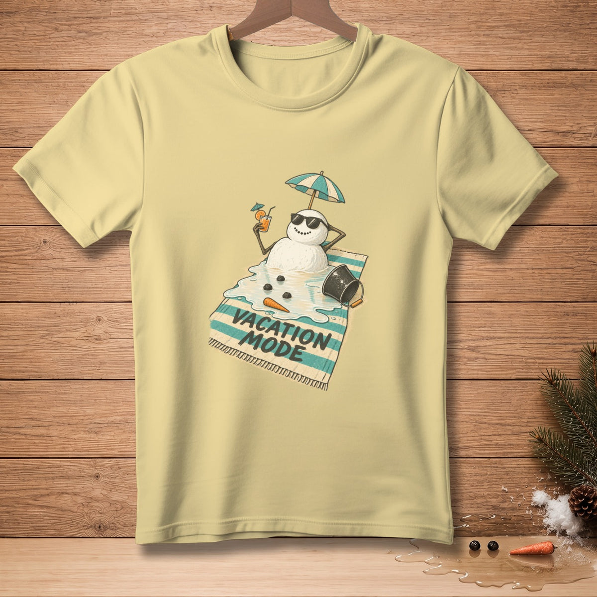 Yellow t-shirt with melting snowman on beach towel, reading "Vacation Mode".