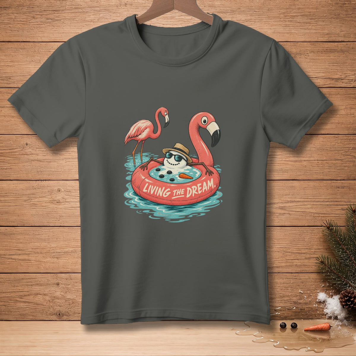 Snowman on flamingo float with text "LIVING THE DREAM" and two flamingos.