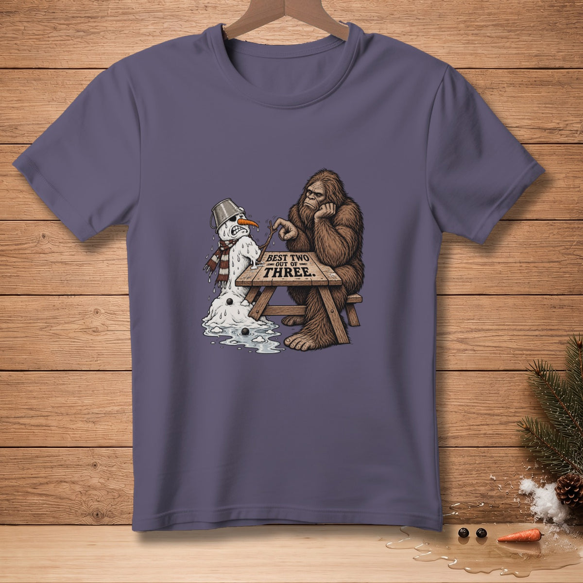 Bigfoot plays tic-tac-toe with a melting snowman, text reads "BEST TWO OUT OF THREE."